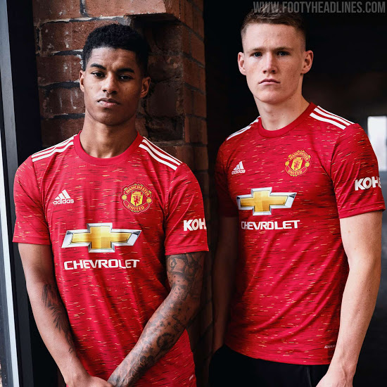 Man United players Marcus Rashford and Scott McTominay model the 2020/21 home kit, donning the iconic Red Devils' badge.